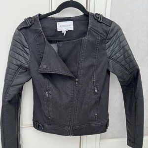 BCBGeneration black denim jacket with black faux leather moto sleeves